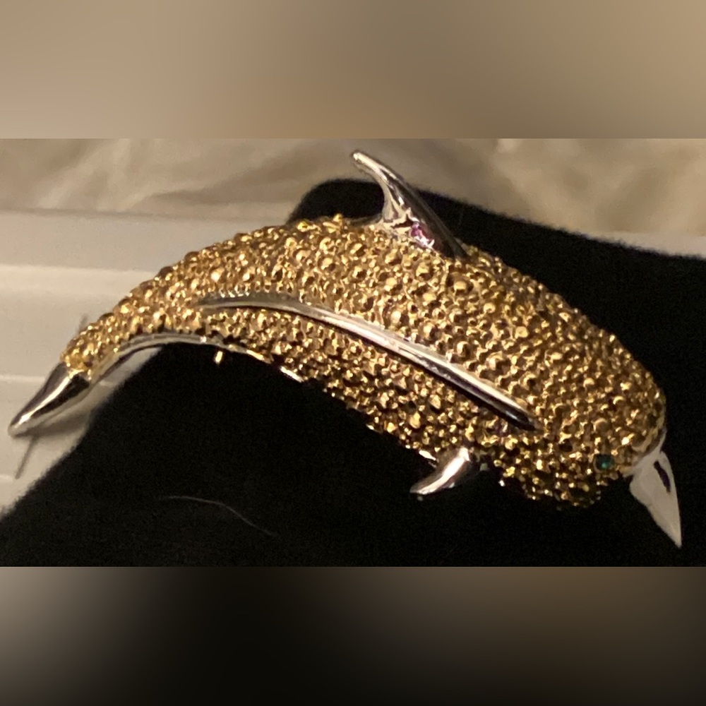Gold plated crystal accented dolphin brooch